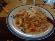 hash brown, eggs, tomato, and red pepper scramble